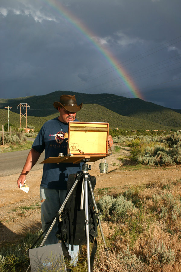 Image: Rainbow behind Rich Gallego while painting